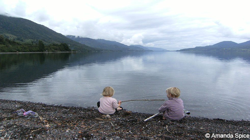 Backpacking with kids: children fishing in lake